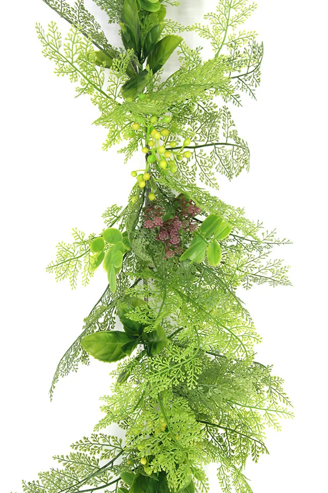 Artificial trailing greenery for shelves and planter arrangements